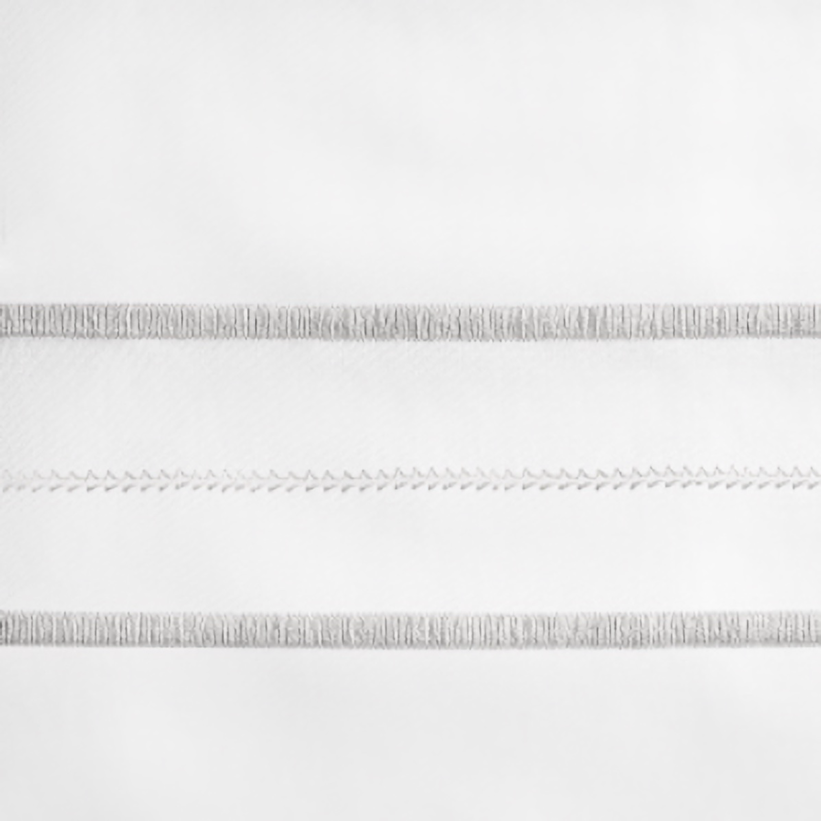 Lifestyle Image of Home Treasures Triad Bedding with White/Pebble Swatch