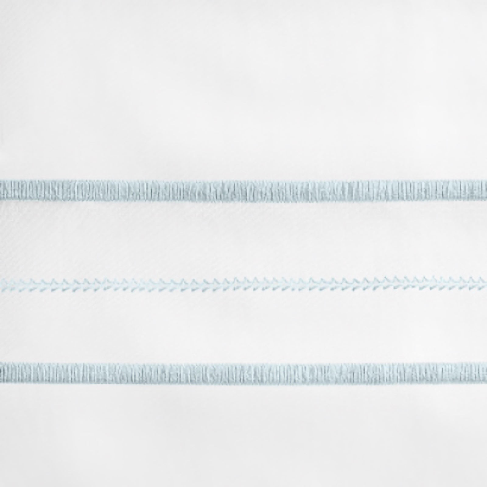 Lifestyle Image of Home Treasures Triad Bedding with White/Sion Blue Swatch