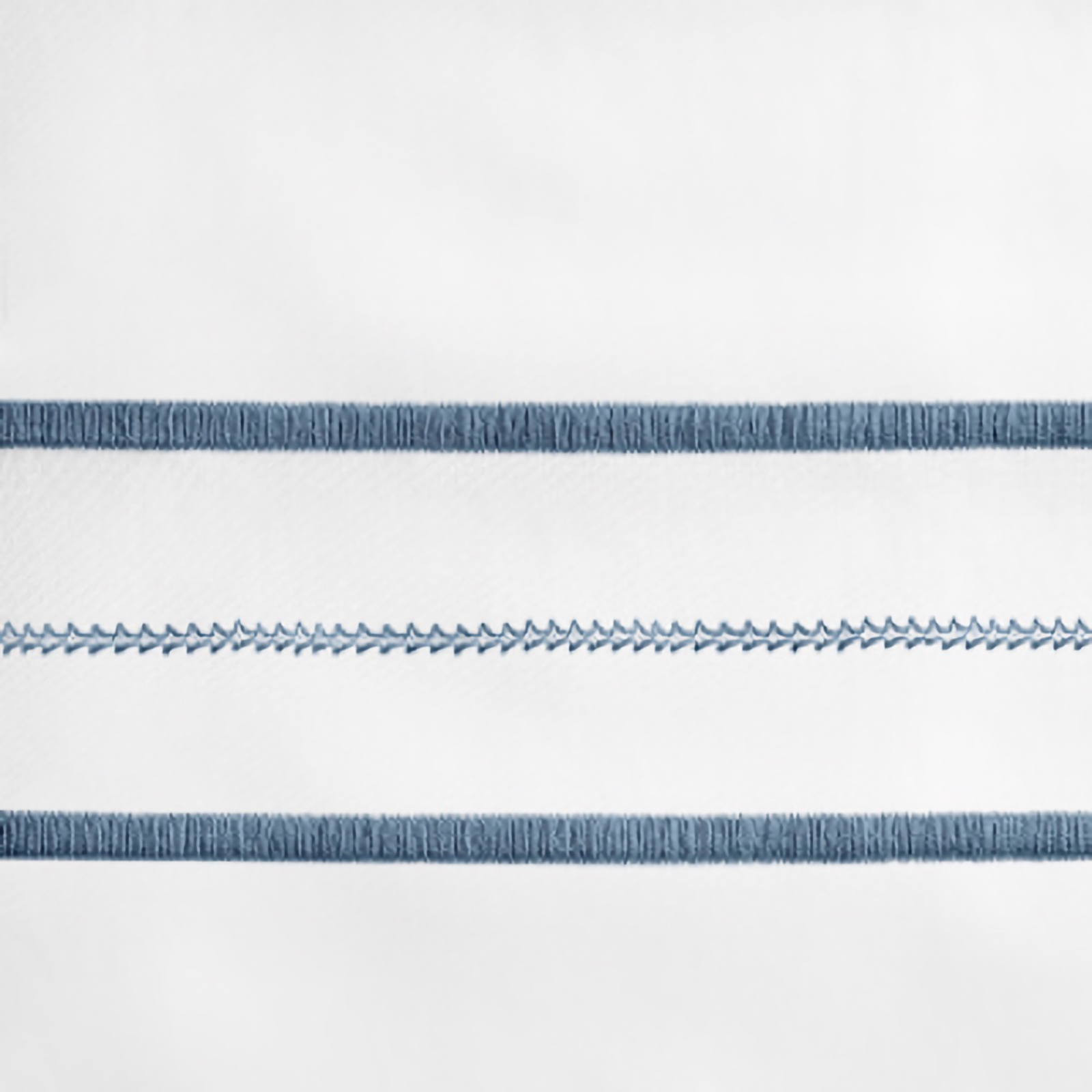 Lifestyle Image of Home Treasures Triad Bedding with White/Slate Blue Swatch