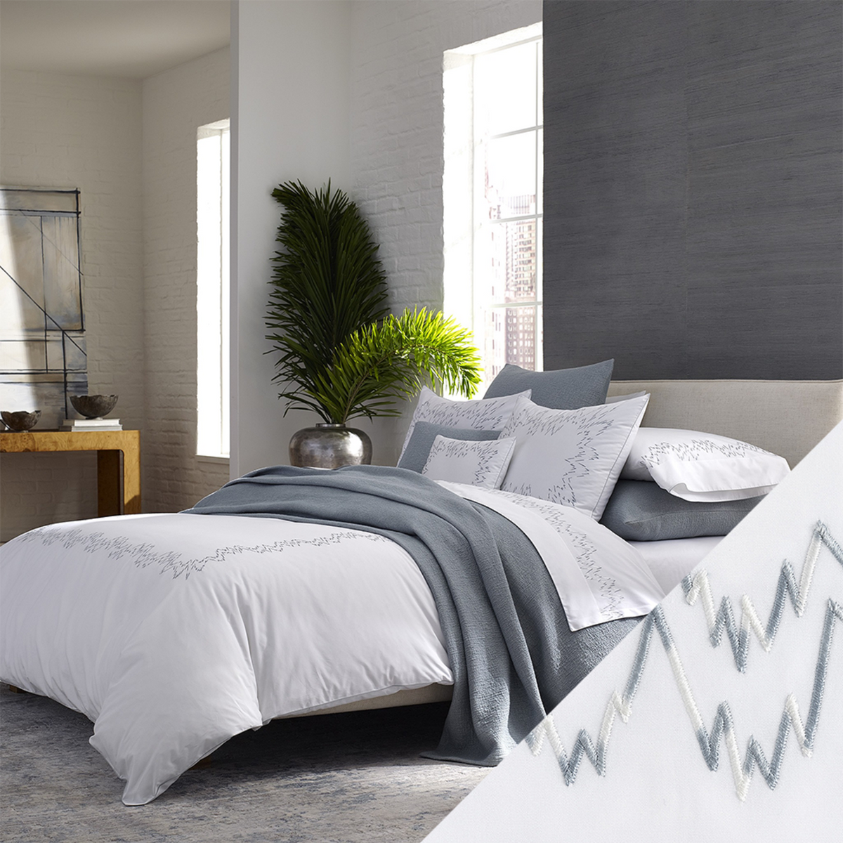 Horizontal View of Matouk Aries Bedding Collection with Wave Swatch Color