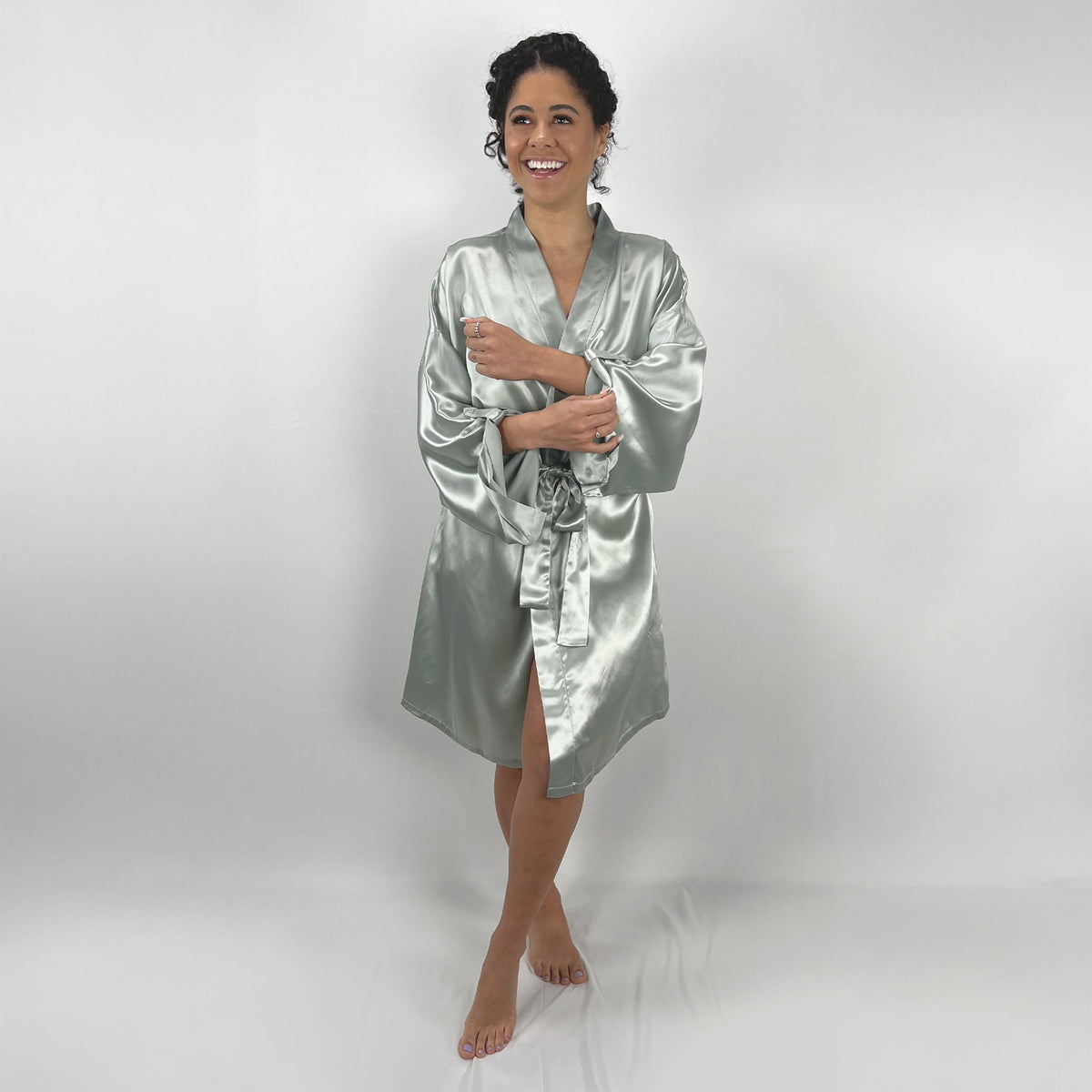 Luxurious sage silk kimono robe with a waist tie, showcasing a soft, silky loungewear look
