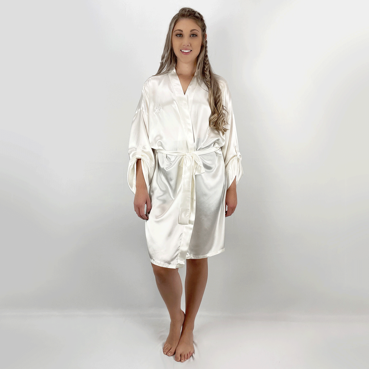 Model wearing a pure silk kimono robe, showcasing its soft texture from various angles in a GIF