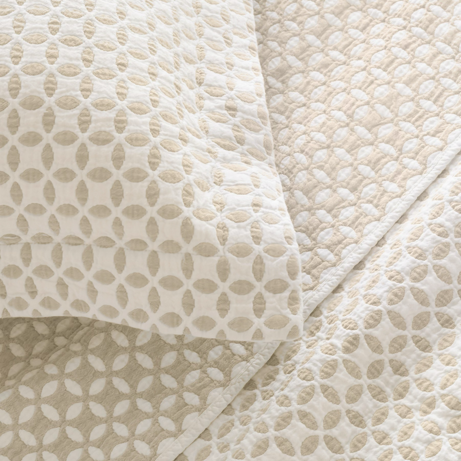 Lands Downunder Leaf Reversible Blanket and Shams in Putty Color on a Bed