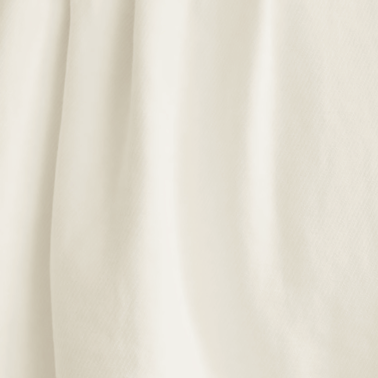 Lands Downunder Bristol Cotton Blanket in Off-White Color on a Bed