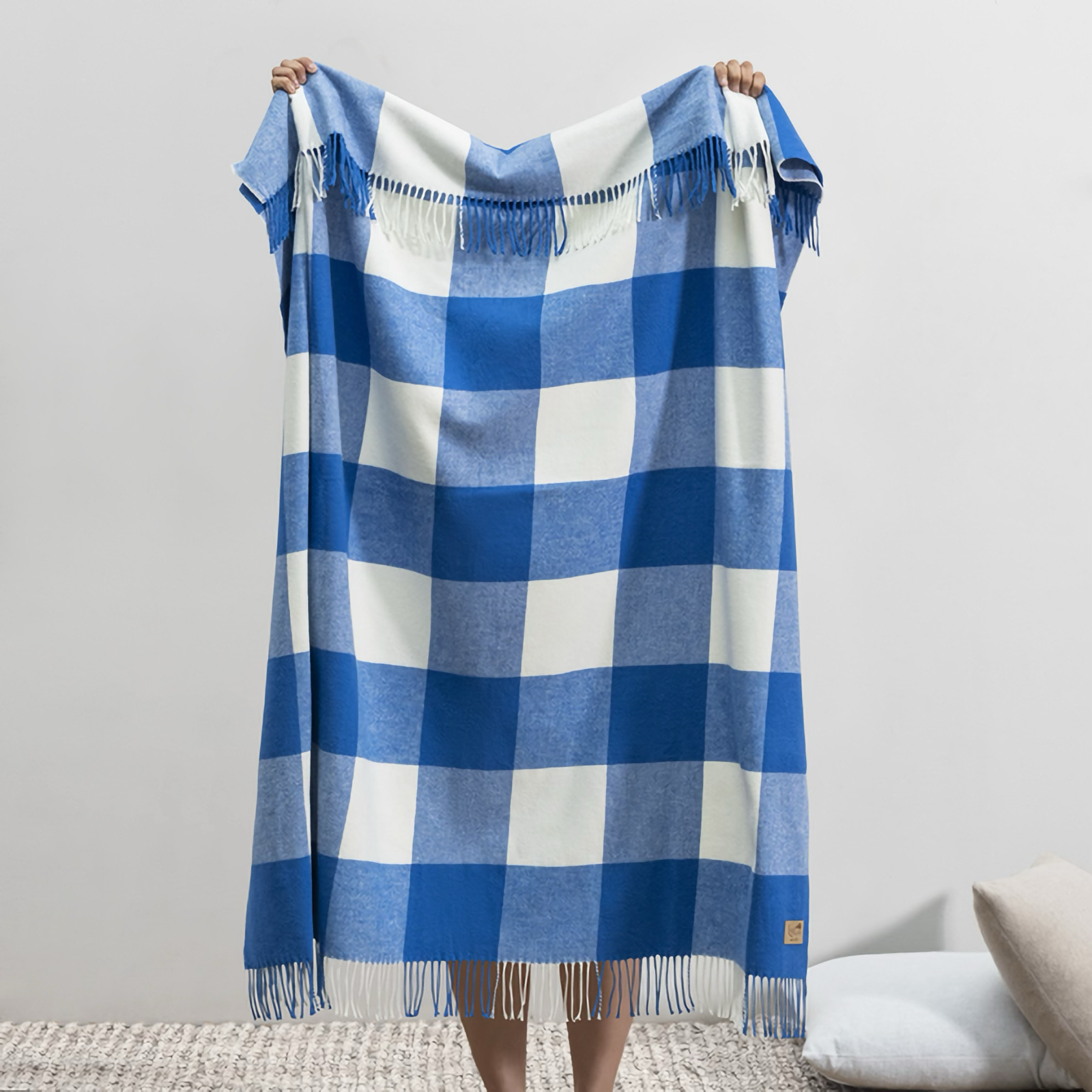 Lifestyle Image of Lands Downunder Buffalo Check Throw in Marina Color