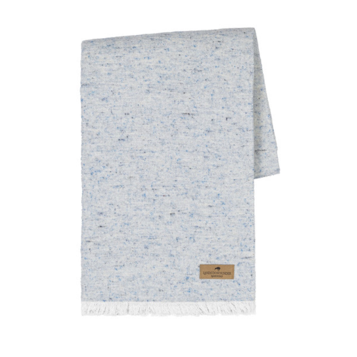 A folded Lands Downunder Cinder Mist Throw in Crystal Blue color with a speckled pattern and white fringed ends