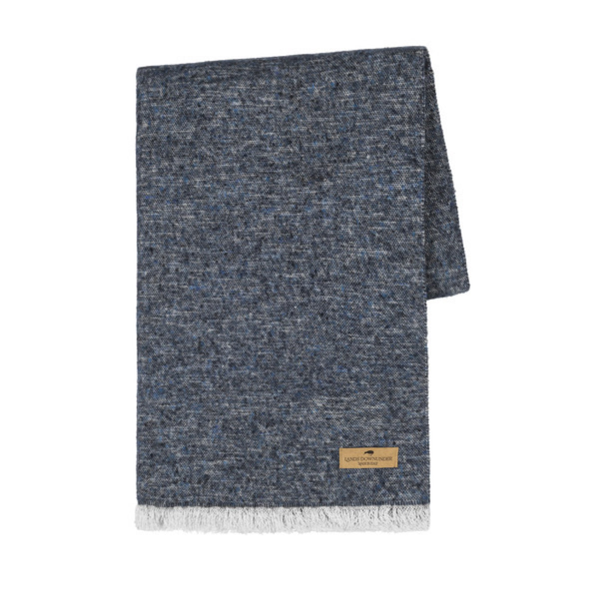 A folded Lands Downunder Cinder Mist Throw in Navy color with a speckled pattern and white fringed ends