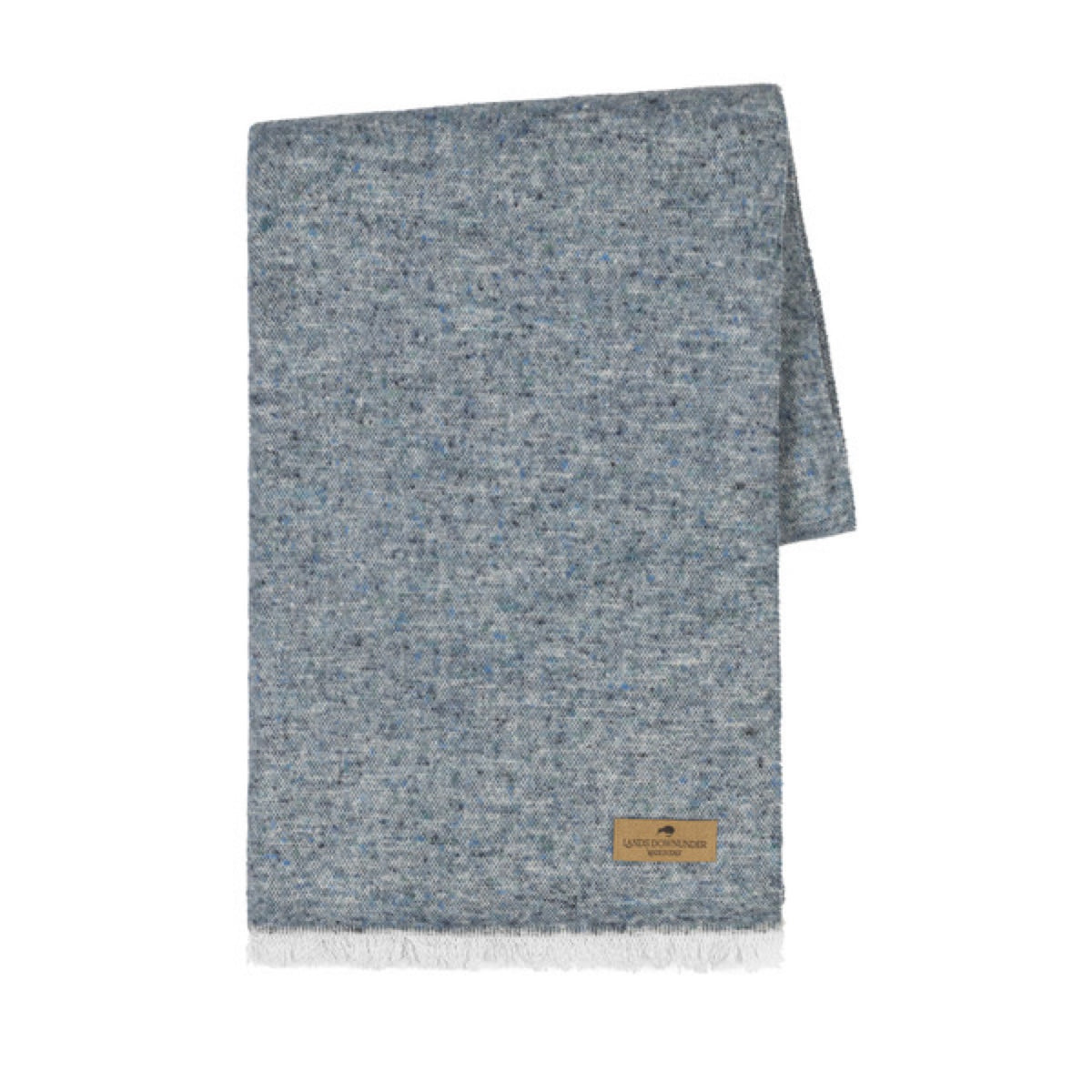 A folded Lands Downunder Cinder Mist Throw in Ocean color with a speckled pattern and white fringed ends