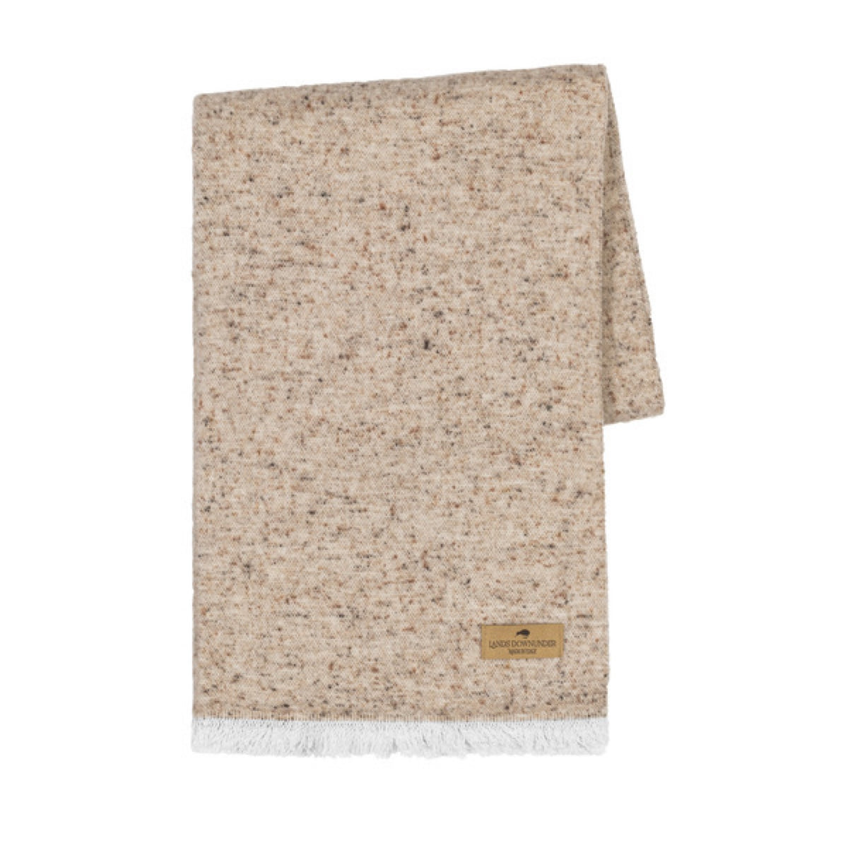 A folded Lands Downunder Cinder Mist Throw in Taupe color with a speckled pattern and white fringed ends