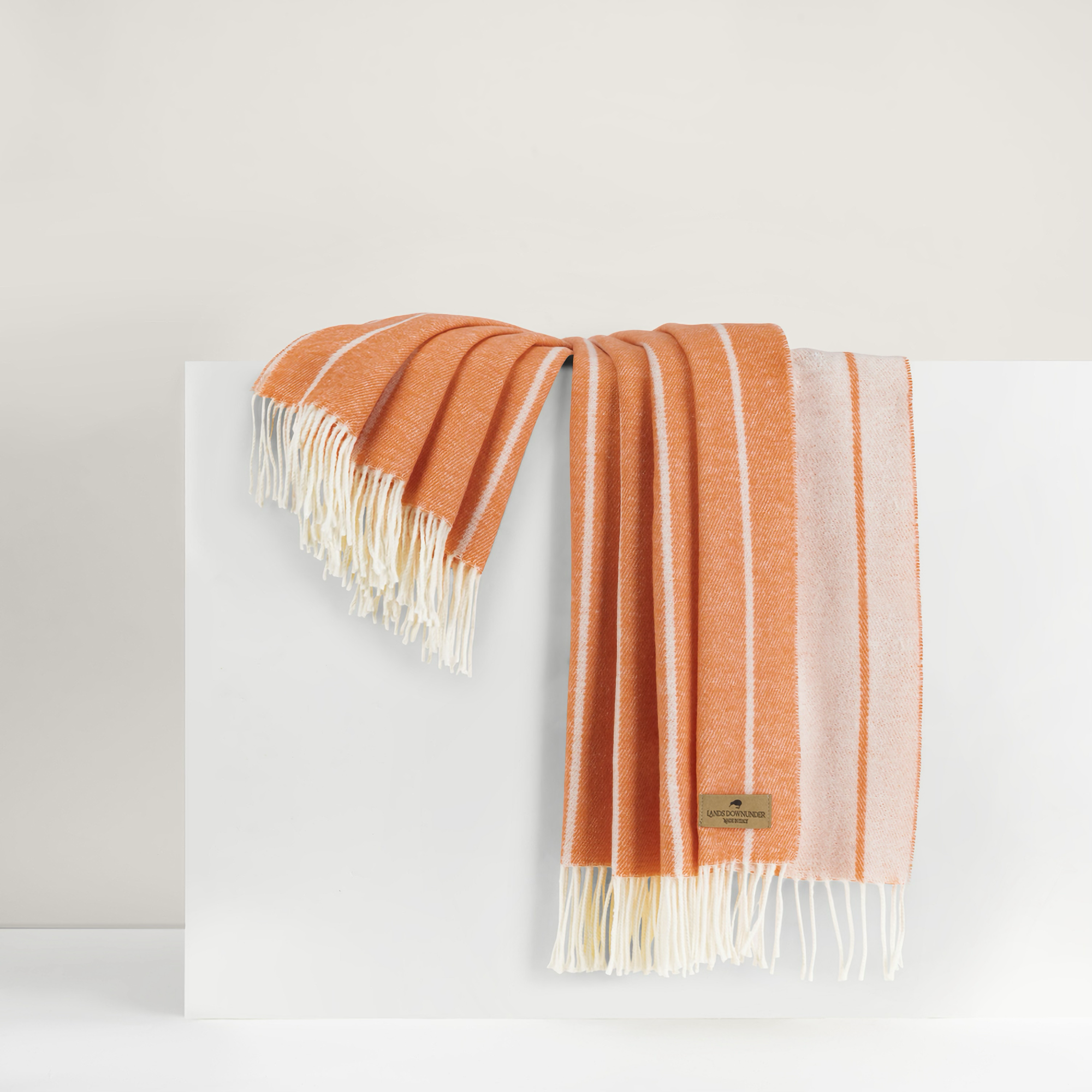 Draped Lands Downunder Fiji Stripe Throw in Papaya Color