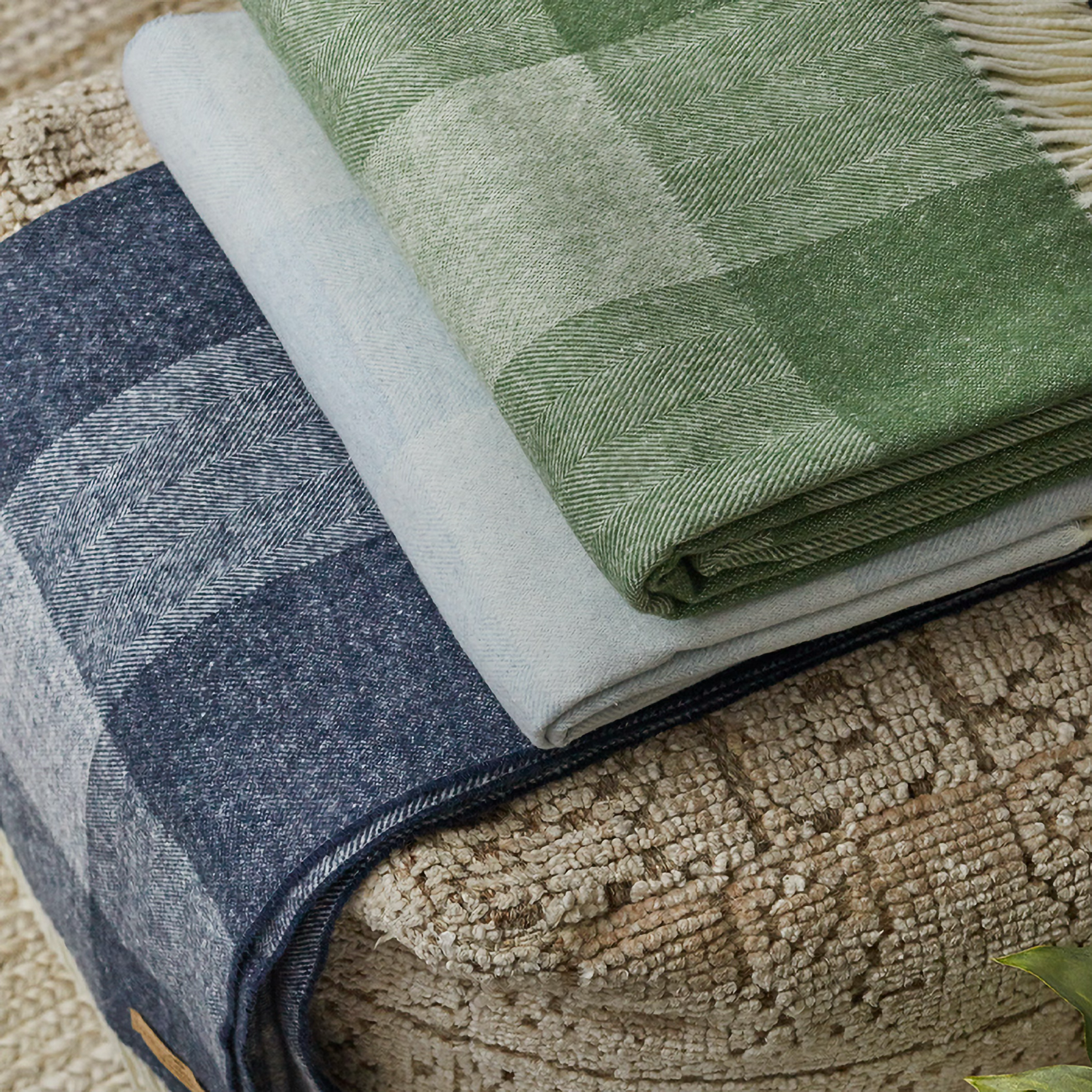 Stack of Draped Lands Downunder Hampton Plaid Herringbone Throws