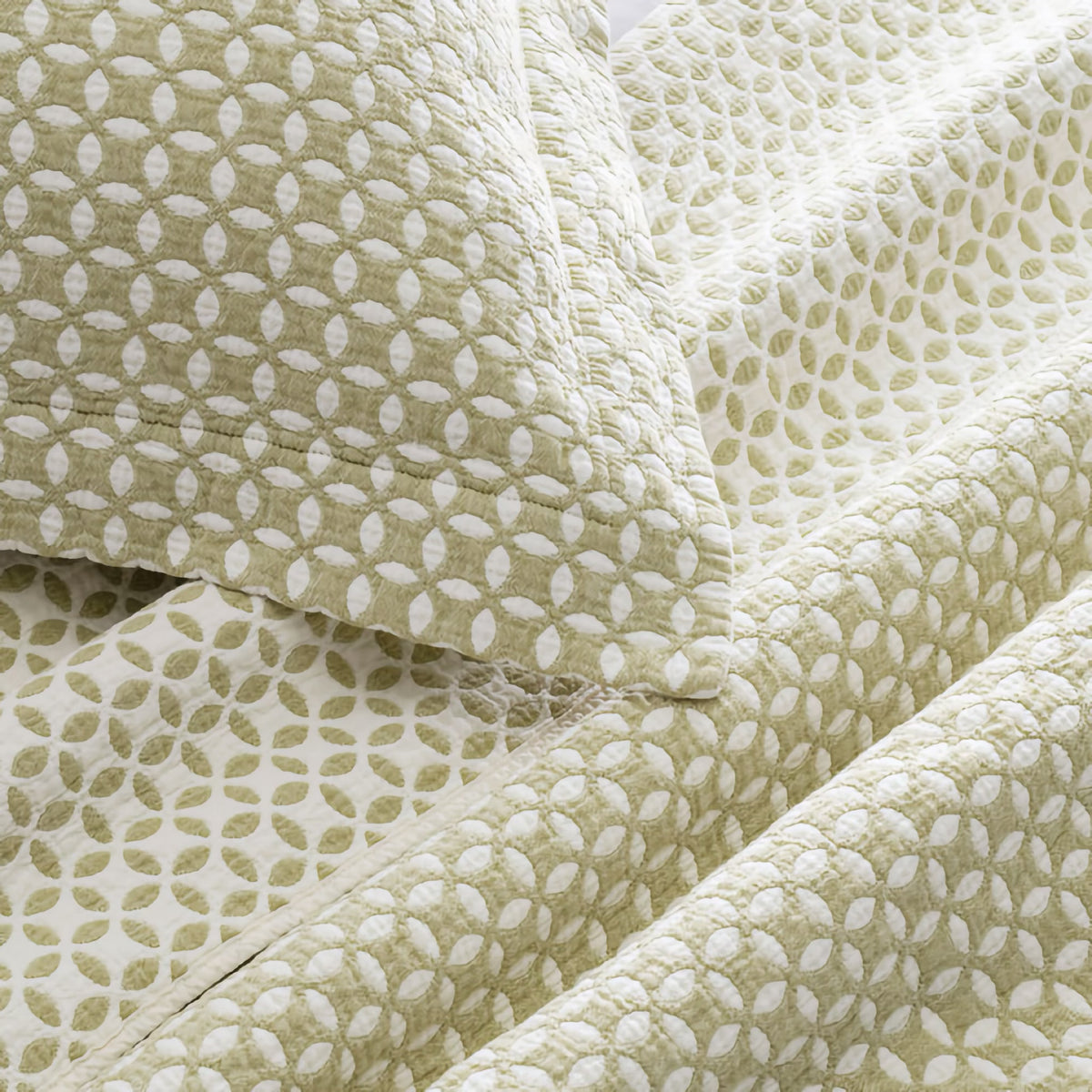 Closeup of Lands Downunder Leaf Reversible Blanket and Shams in Tarragon color