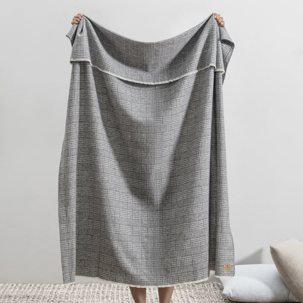 Lands Downunder Sutton Plaid Throw - Charcoal - held image