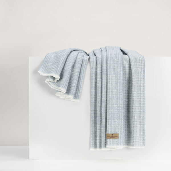 Lands Downunder Sutton Plaid Throw - Crystal Blue - draped image