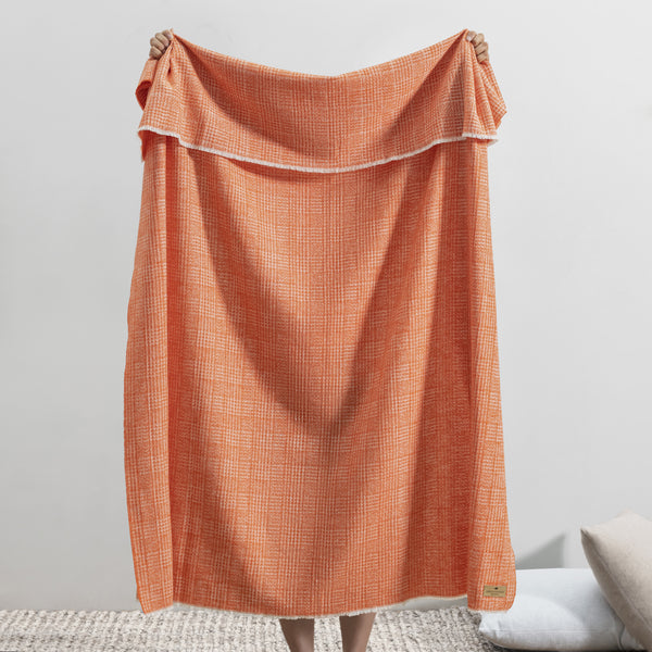 Lands Downunder Sutton Plaid Throw - Mandarin - Held Image