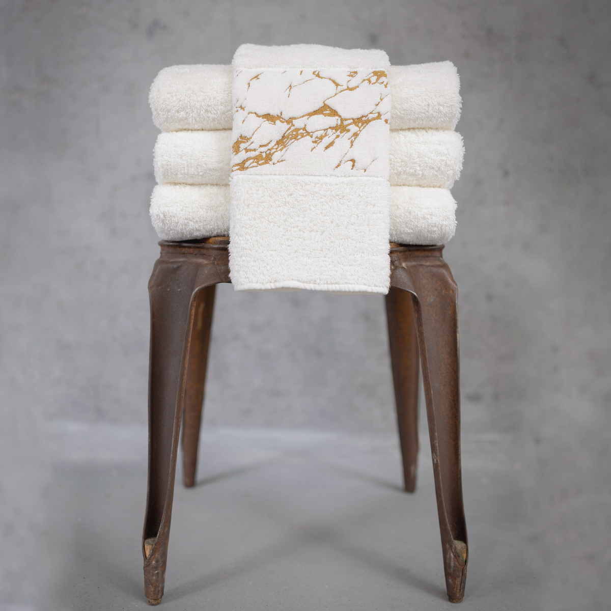 Lifestyle Image of Abyss Alpi Hand Towels in Gold Color