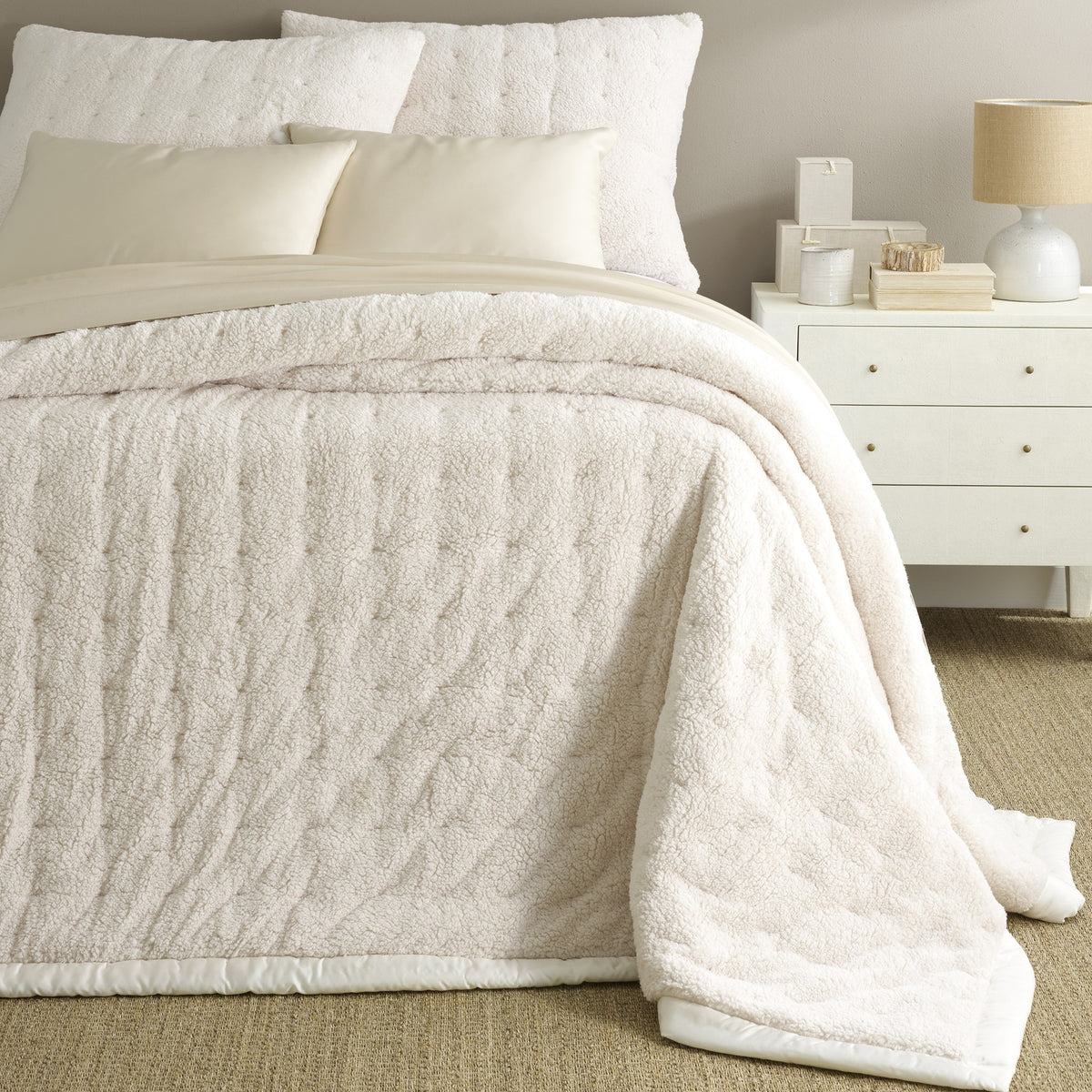 Corner Shot of Bed in Pine Cone Hill Marshmallow Fleece Puff in Ivory Color