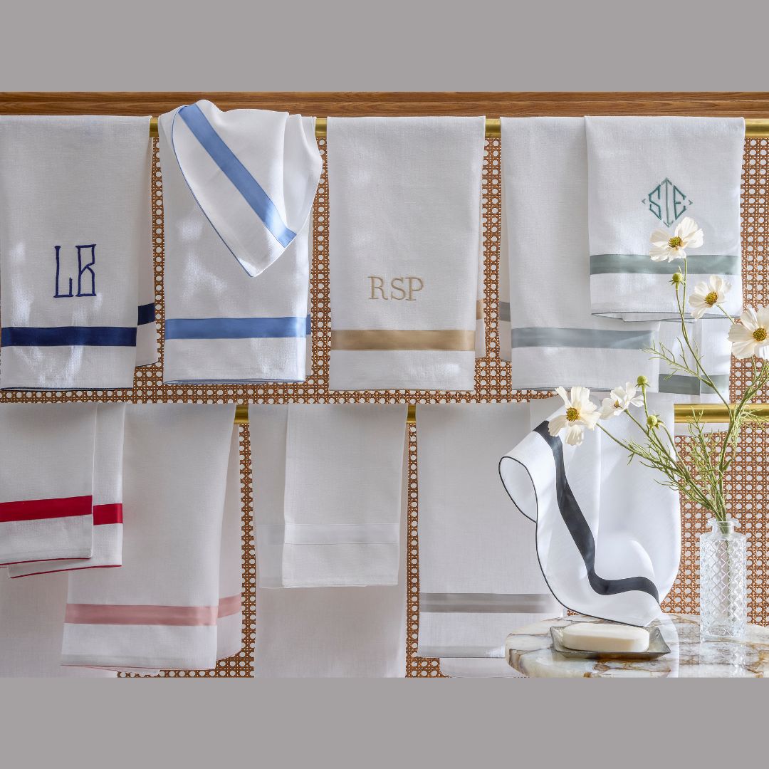 Matouk Lowell Guest Towels on a towel rack