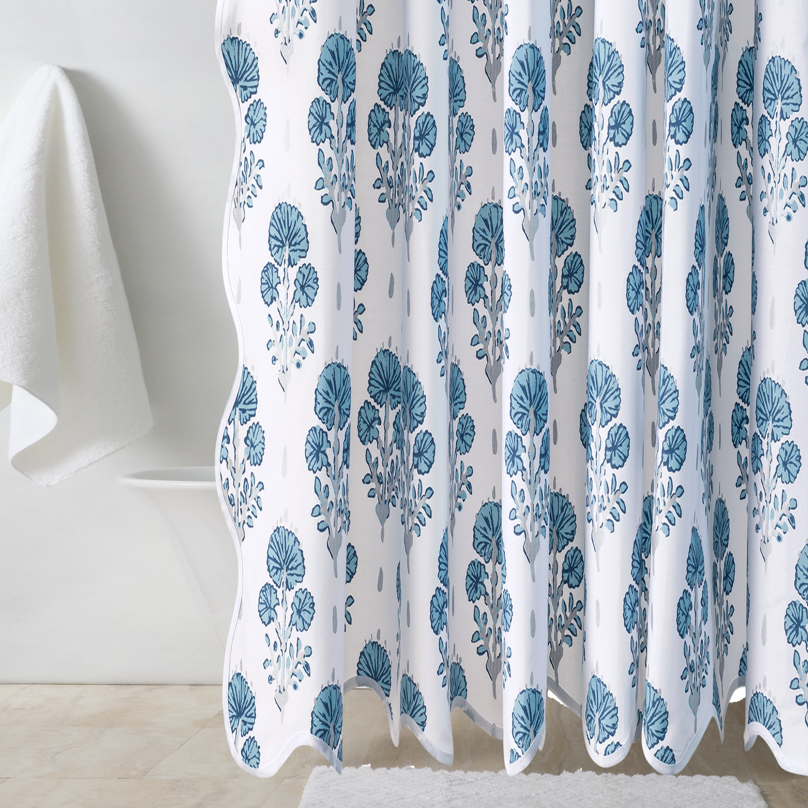 Bath Tub Behind a Lulu DK Matouk Joplin Shower Curtain in Mineral Blue Color