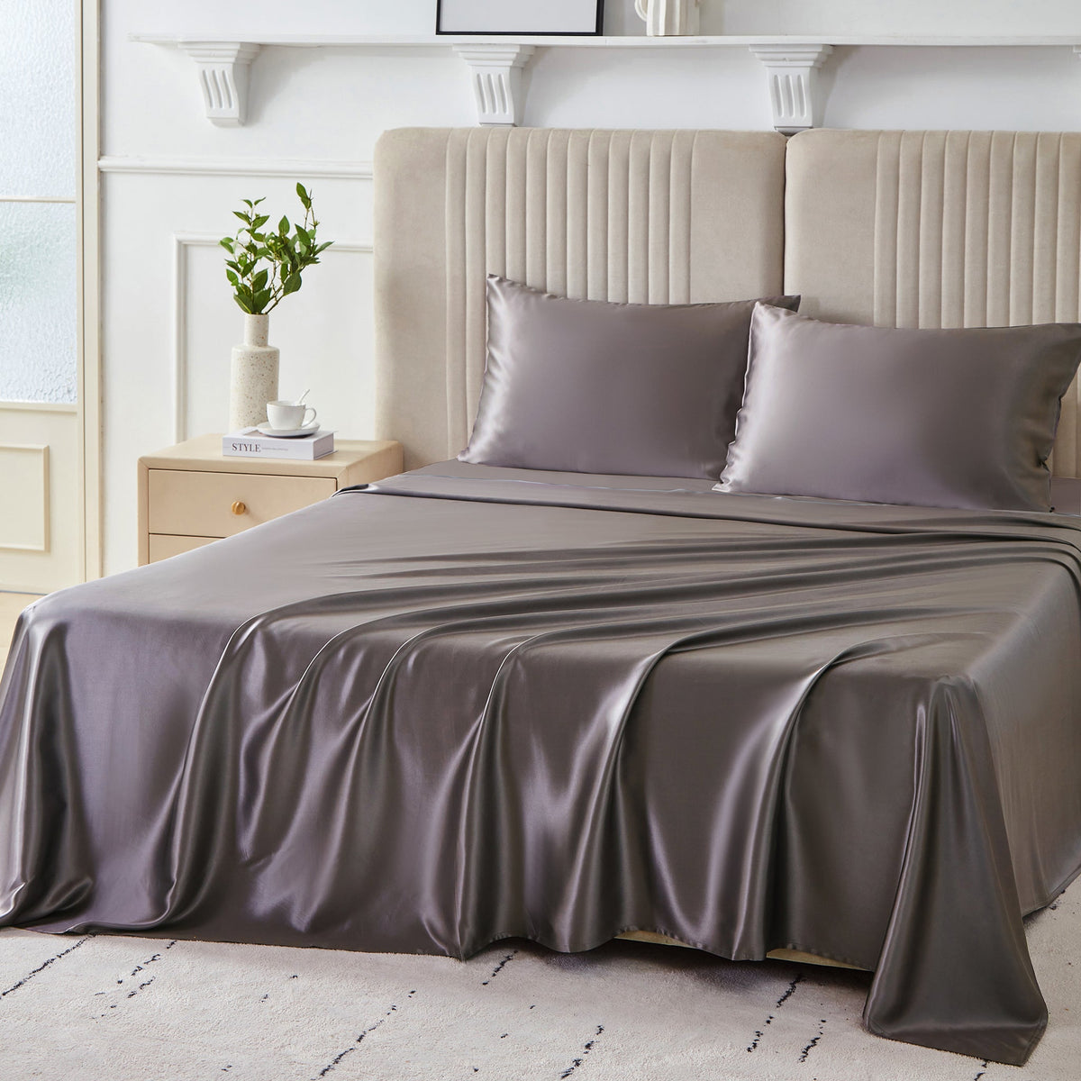 Elegant 22 Momme Silk Sheets Set in Gunmetal color displayed on a beautiful bed with silk pillows