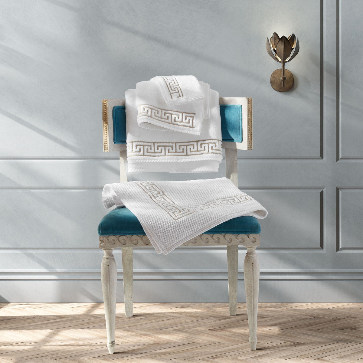 Lifestyle of Matouk Adelphi Bath Towels on Chair