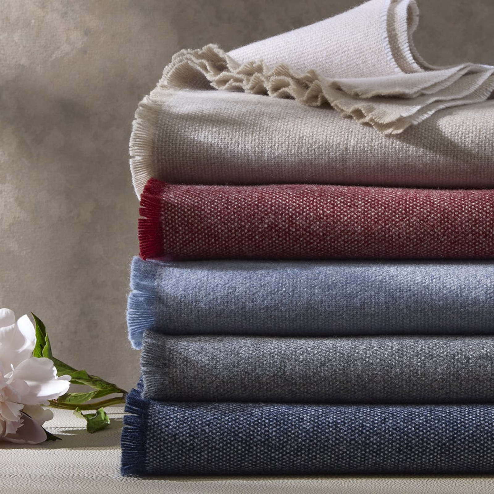 Stack of Matouk Agnes Throws in All Colors