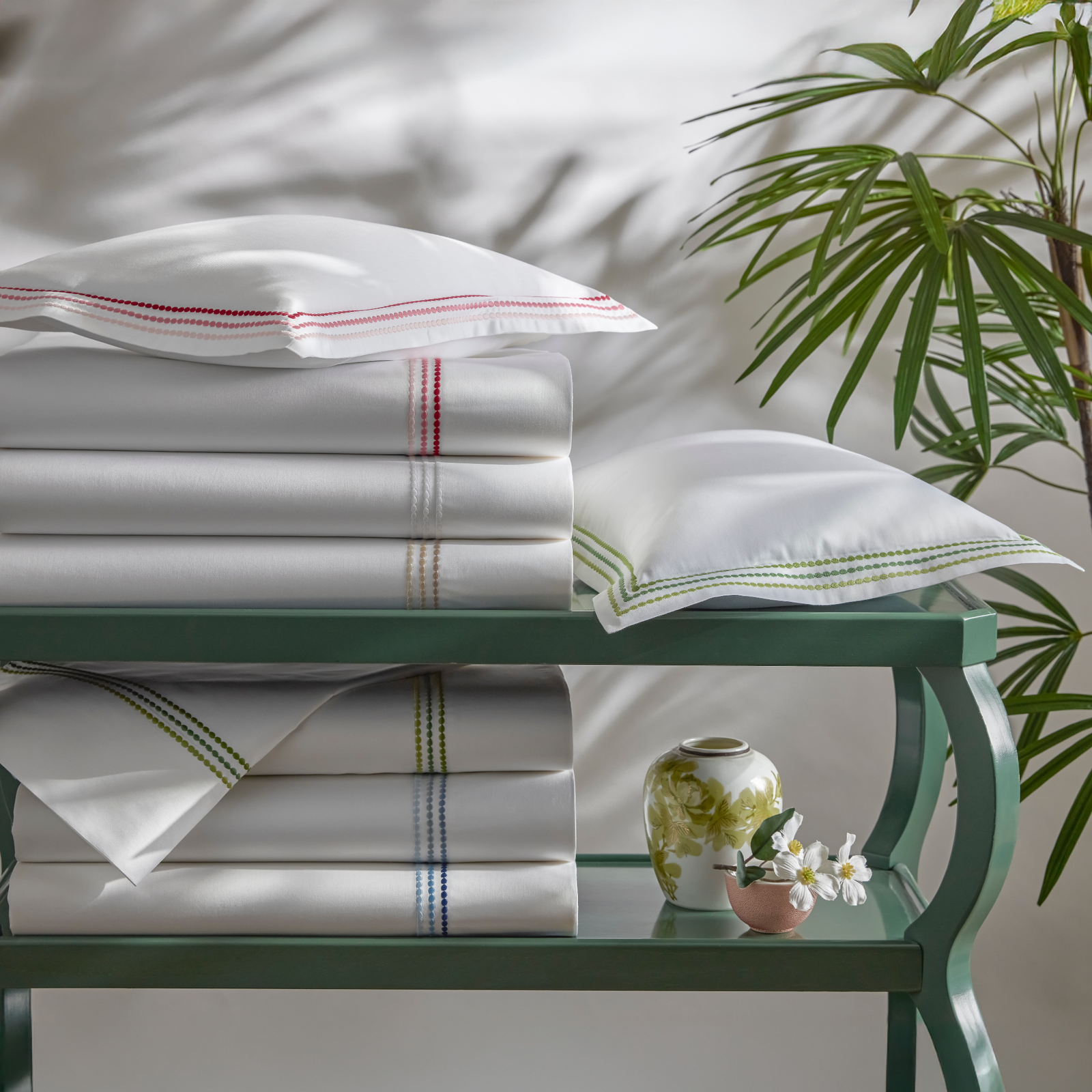 Stack of Matouk Amara Triple Pearl Bedding