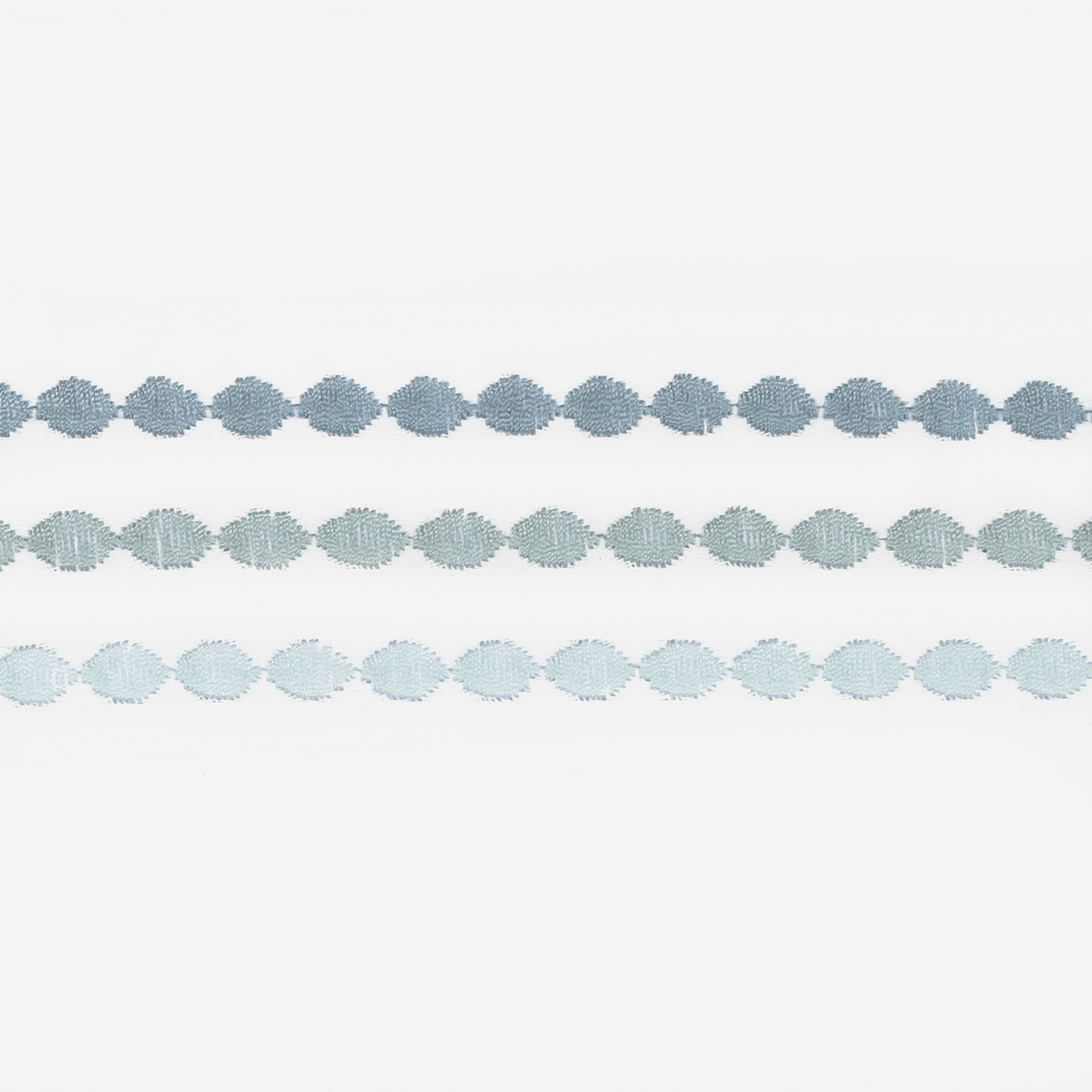 Side view of Bed in Matouk Amara Triple Pearl Bedding Collection with Hazy Pool Swatch