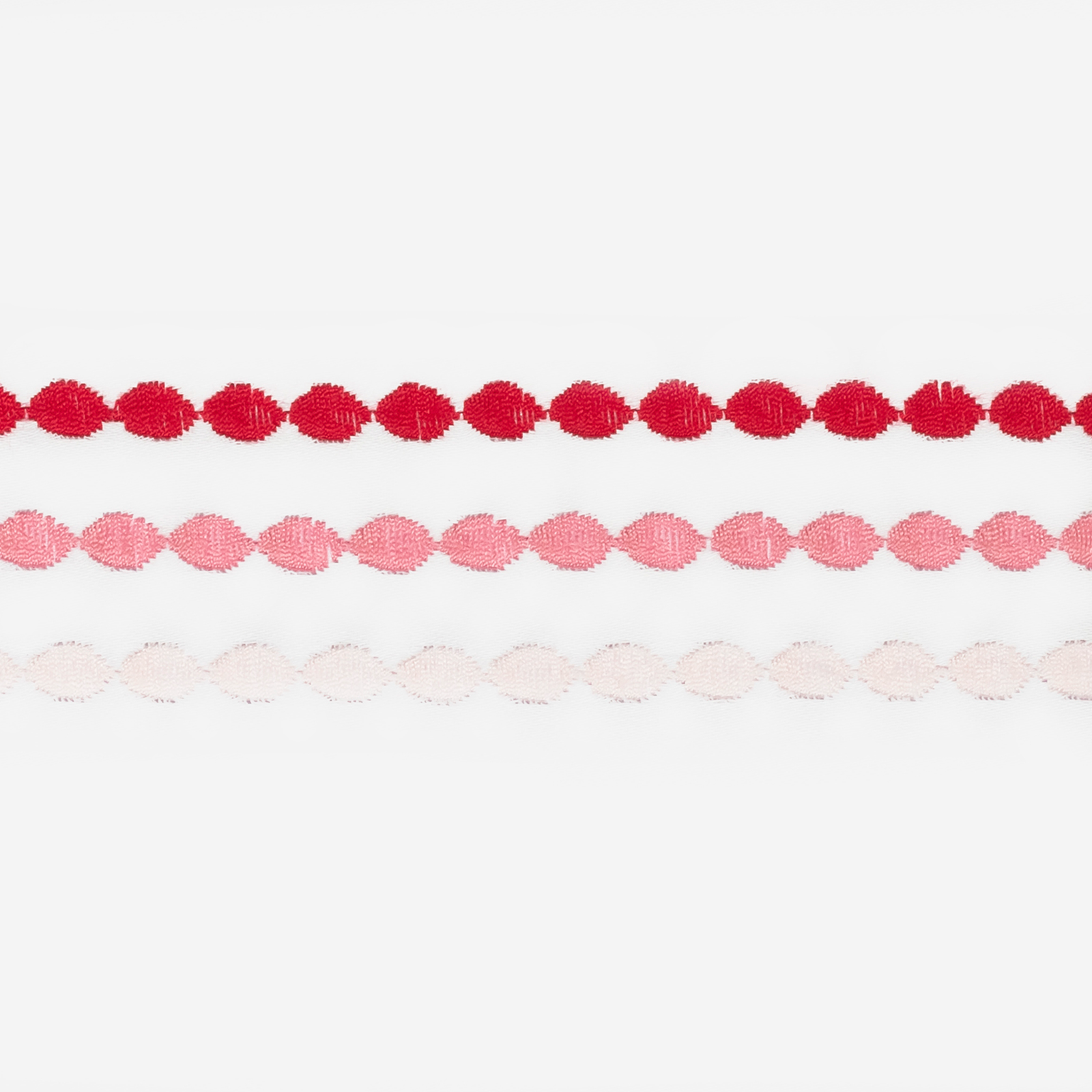 Stack of Matouk Amara Triple Pearl Bedding