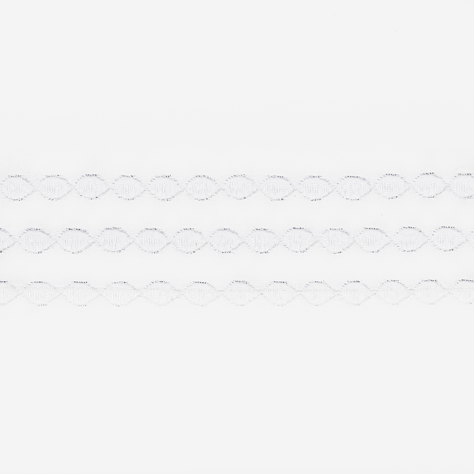 Side view of Bed in Matouk Amara Triple Pearl Bedding Collection with White Swatch