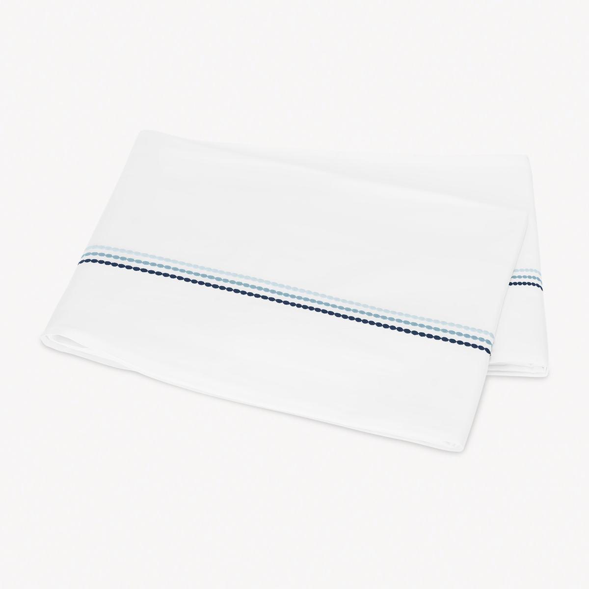 Folded Flat Sheet of Matouk Amara Triple Pearl Bedding in Sailor Blue