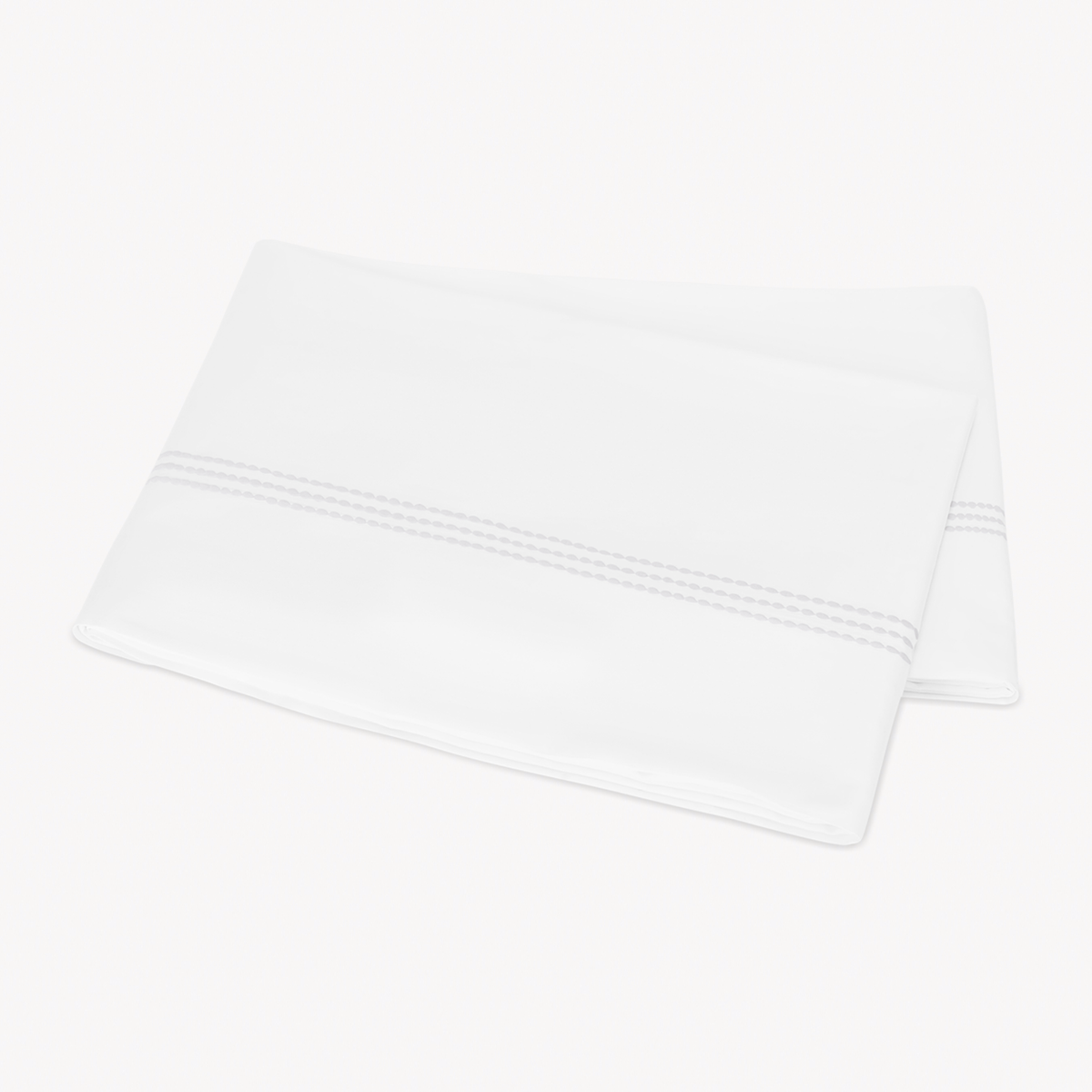 Folded Flat Sheet of Matouk Amara Triple Pearl Bedding in White