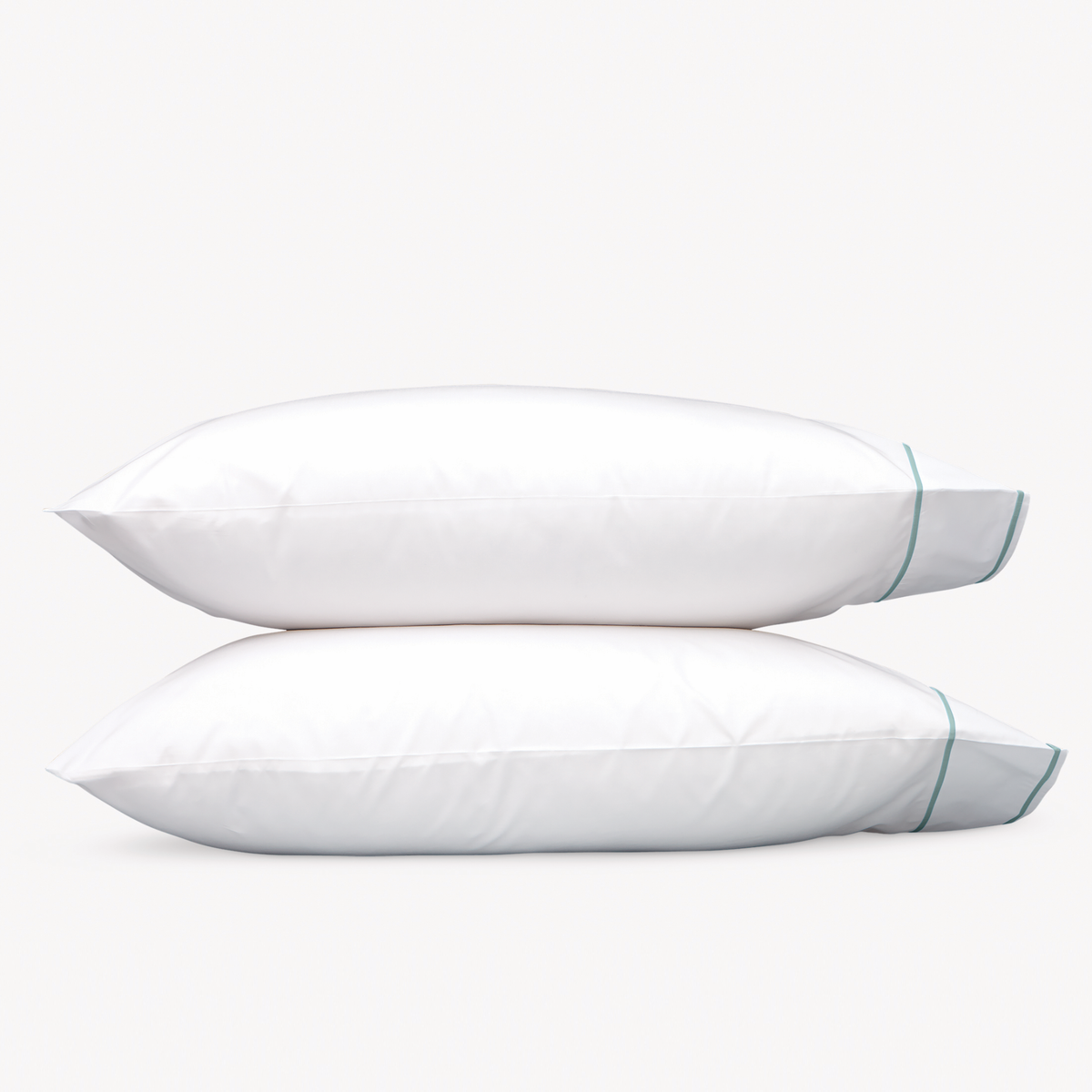 Pillowcases of Matouk Ansonia Bedding in Pool color