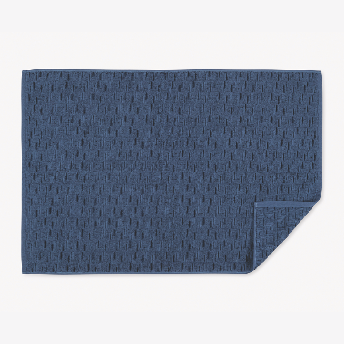 Folded Matouk Schumacher Athena Tubmat in Navy