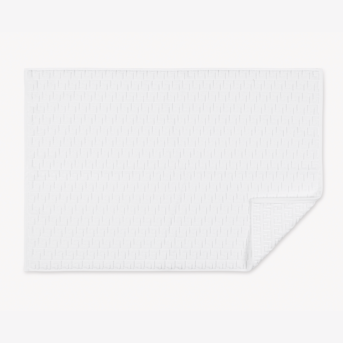 Folded Matouk Schumacher Athena Tubmat in White