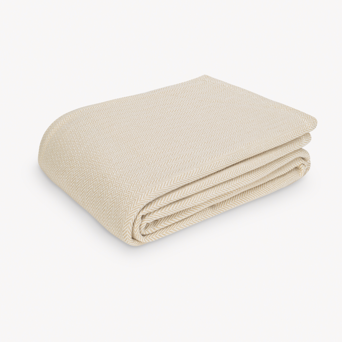 Folded Matouk Avalon Blanket in Champagne color