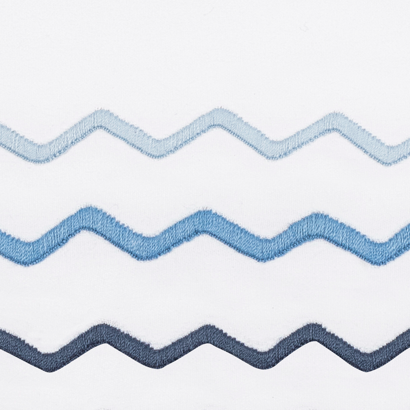 Matouk Axel Bedding in Azure with Dream Modal on a bed - hero image