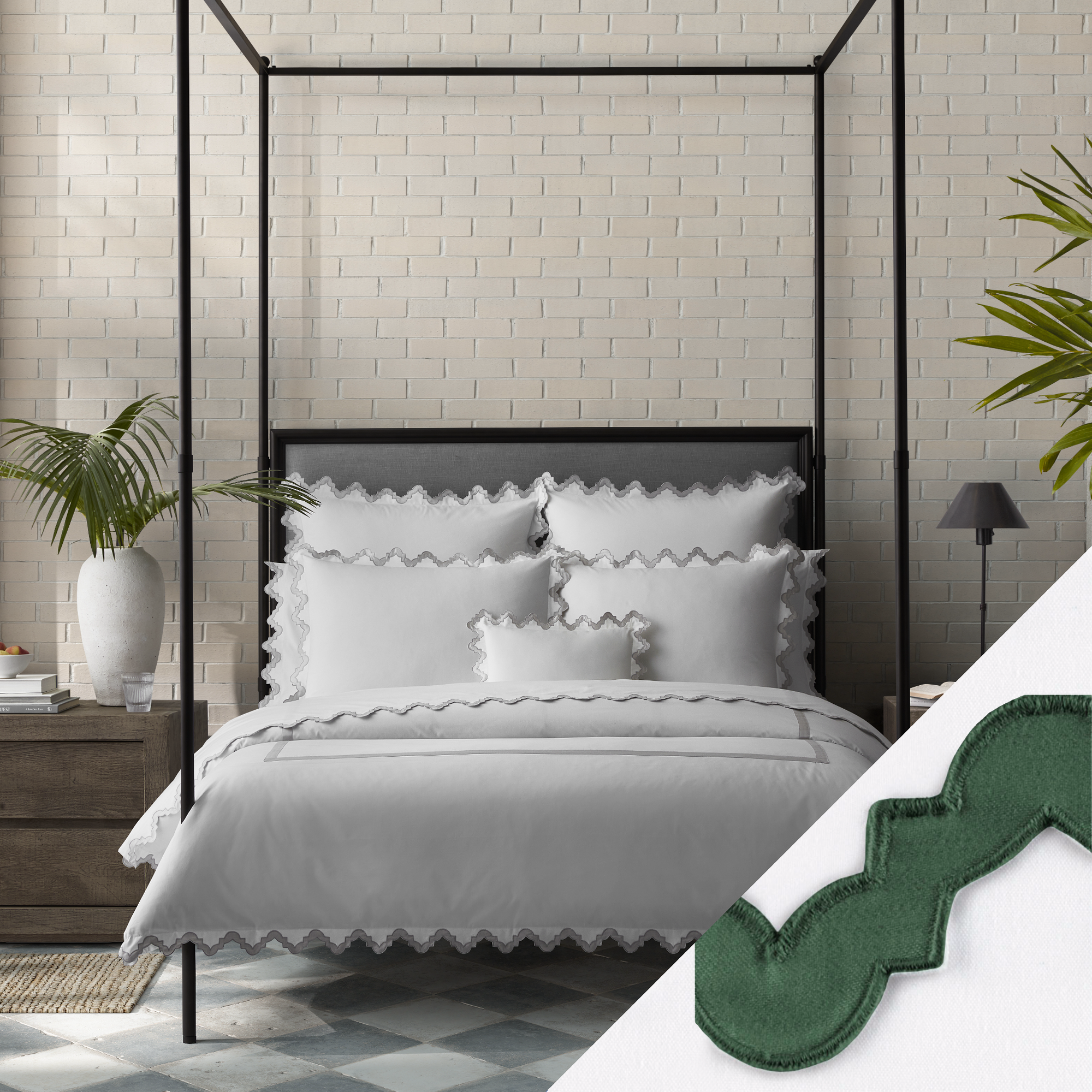 Lifestyle Image of a Full Bed Dressed in Matouk Aziza Bedding in Silver Color with Green Swatch