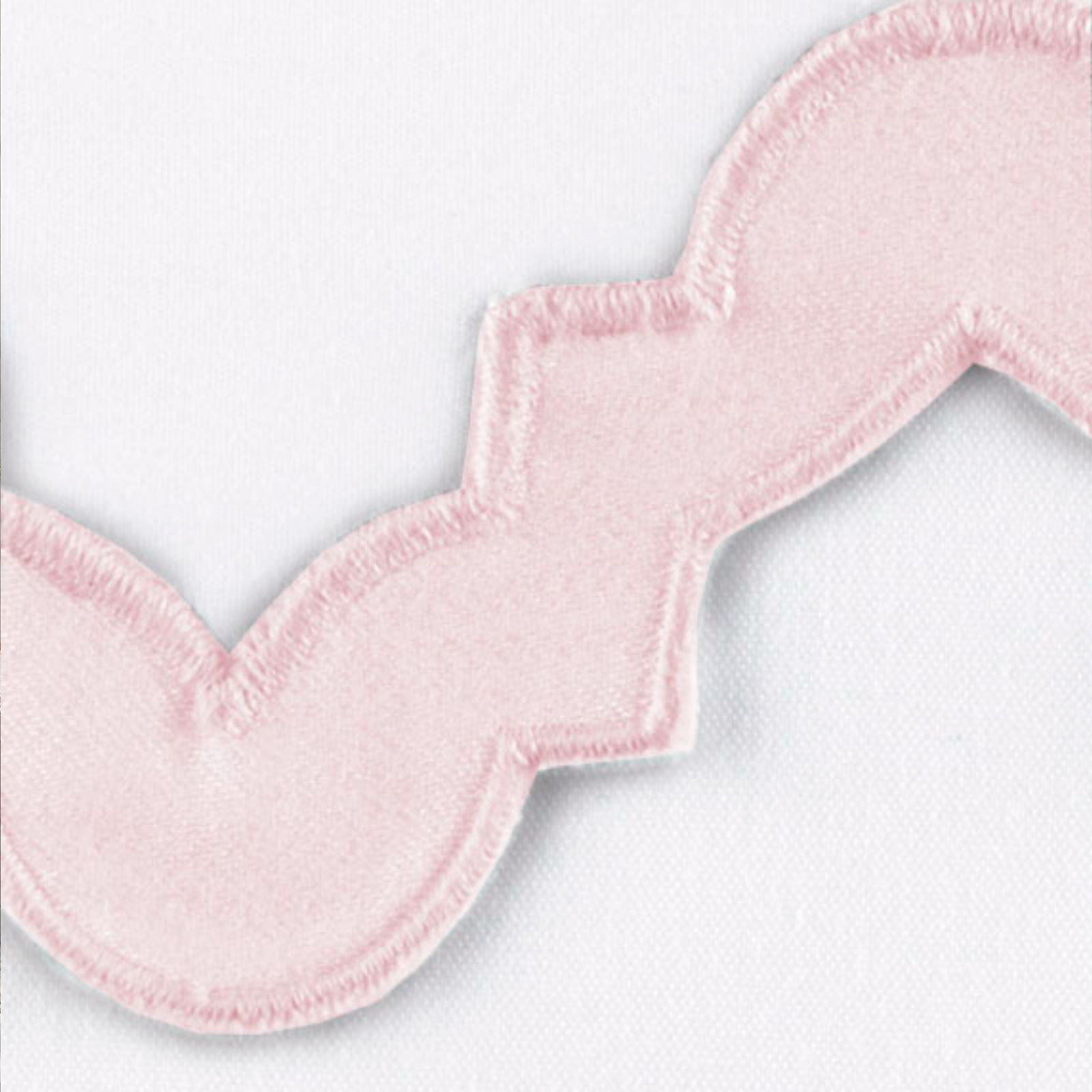 Lifestyle Image of a Full Bed Dressed in Matouk Aziza Bedding in Silver Color with Pink Swatch