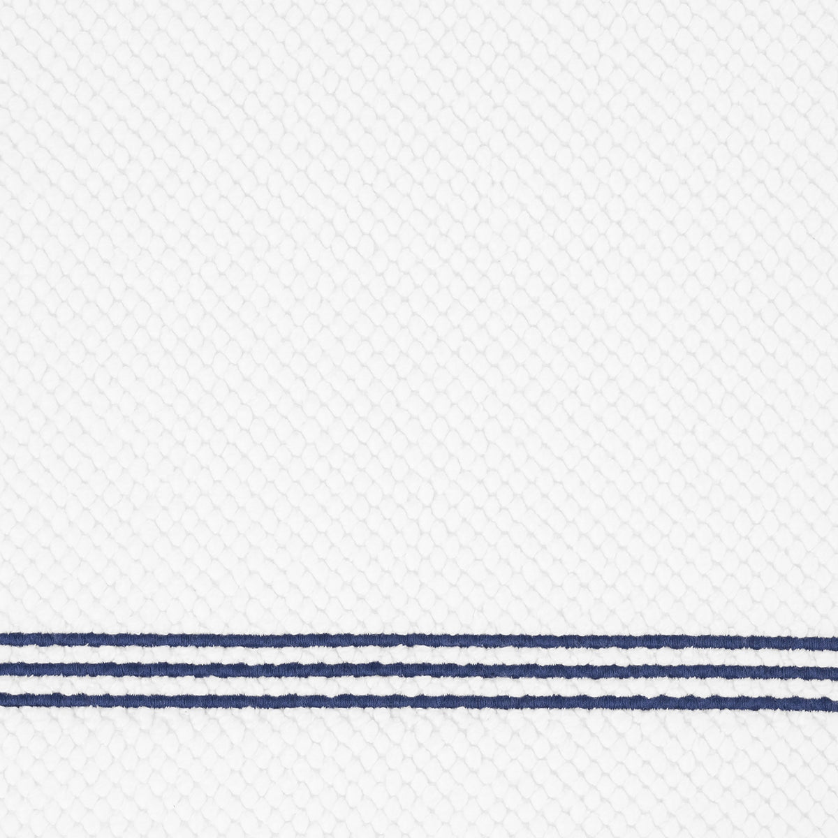 Closeup of Matouk Bel Tempo Bath Rug with Navy Trio Lines