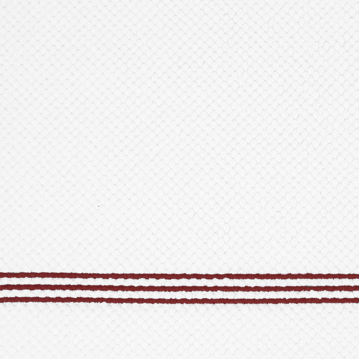 Closeup of Matouk Bel Tempo Bath Rug with Red Trio Lines