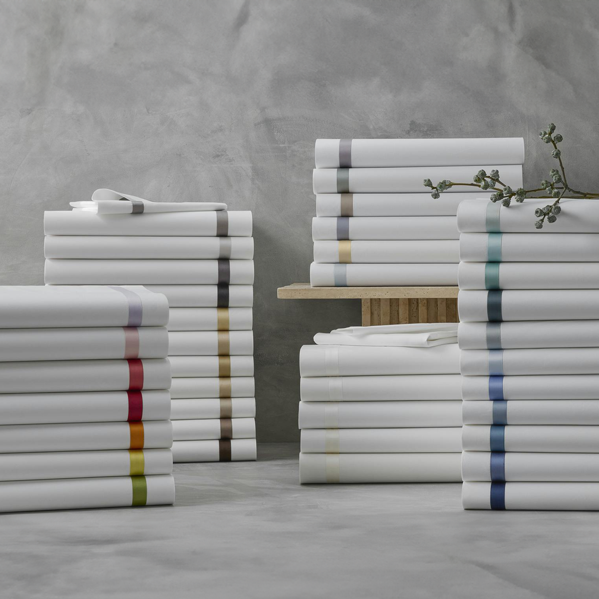 Stack of Folded Matouk Lowell Collection in All Colors in 2024