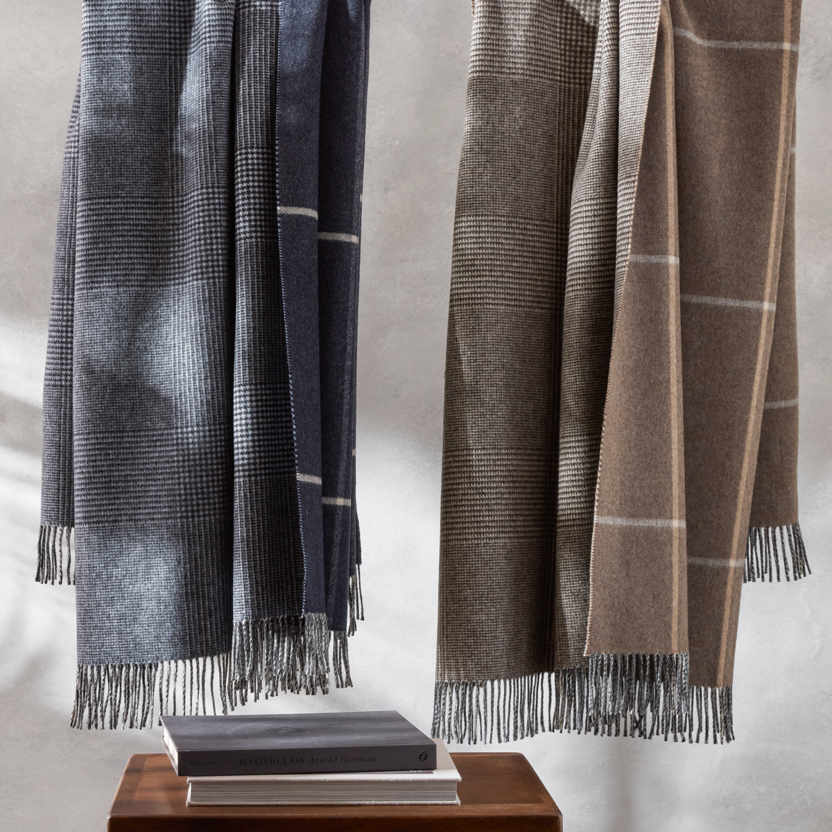 Hanging Matouk Benito Throws in Hazelnut and Night colors