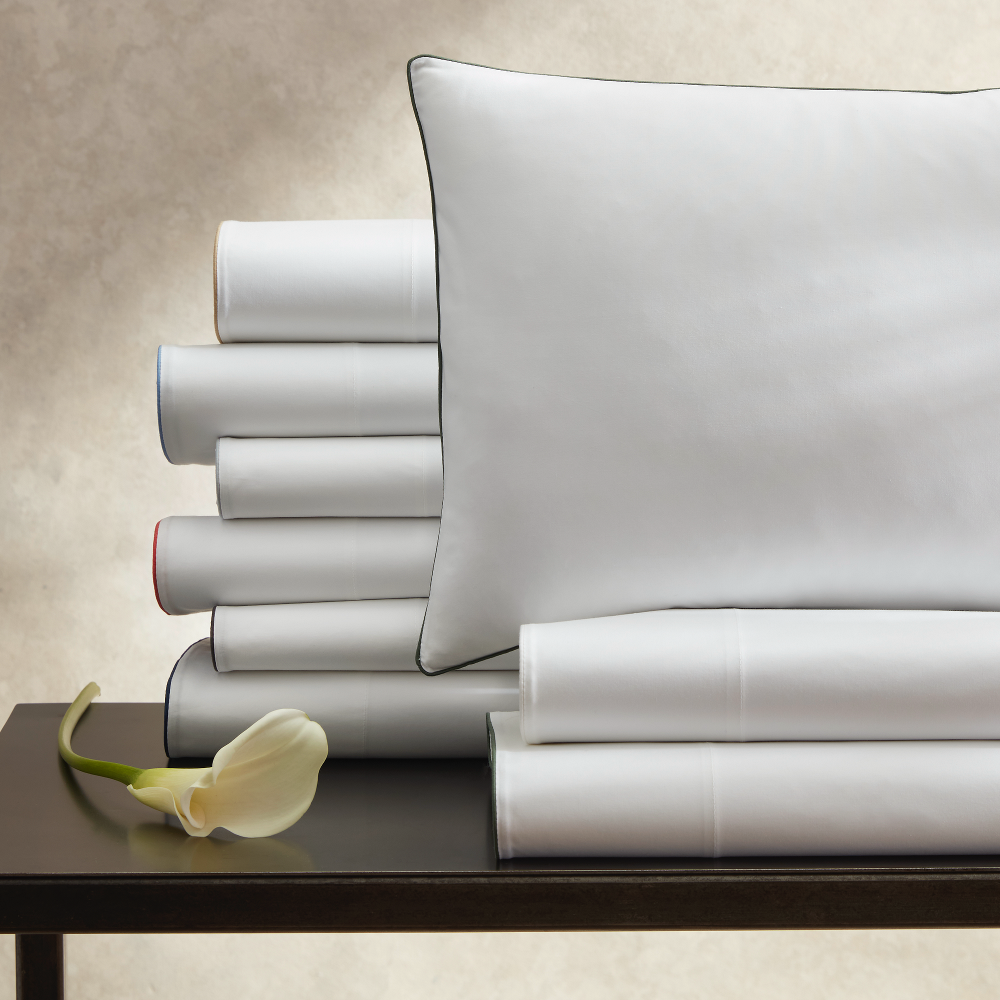 Stack of Matouk Bryant Bedding Fine Linens in All Colors