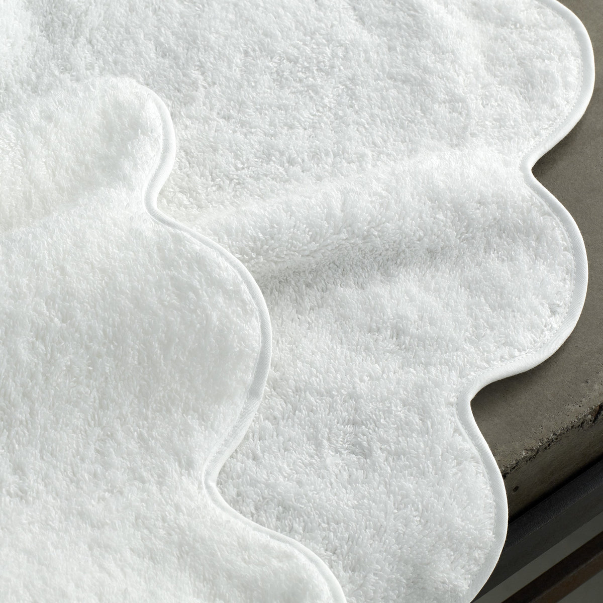 Close Up of Matouk Cairo Scallop Bath Towels and Mats in White Color