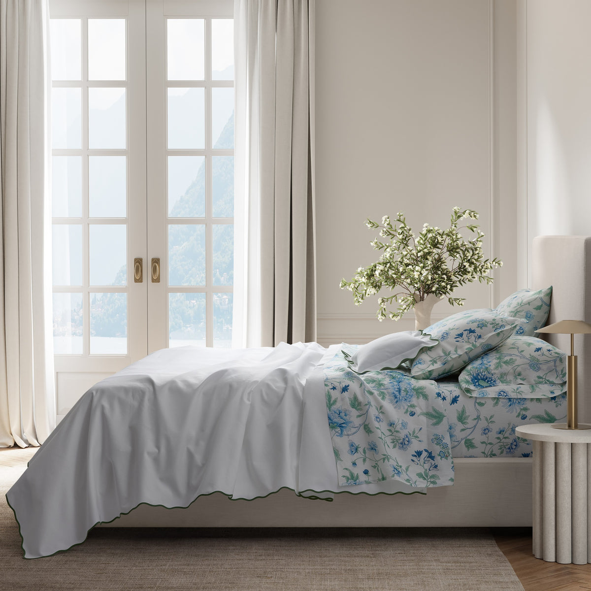 Bed Dressed in Palm Matouk Camilla Pique Bedding with Matouk Simone Linen Bedding in Sea Color