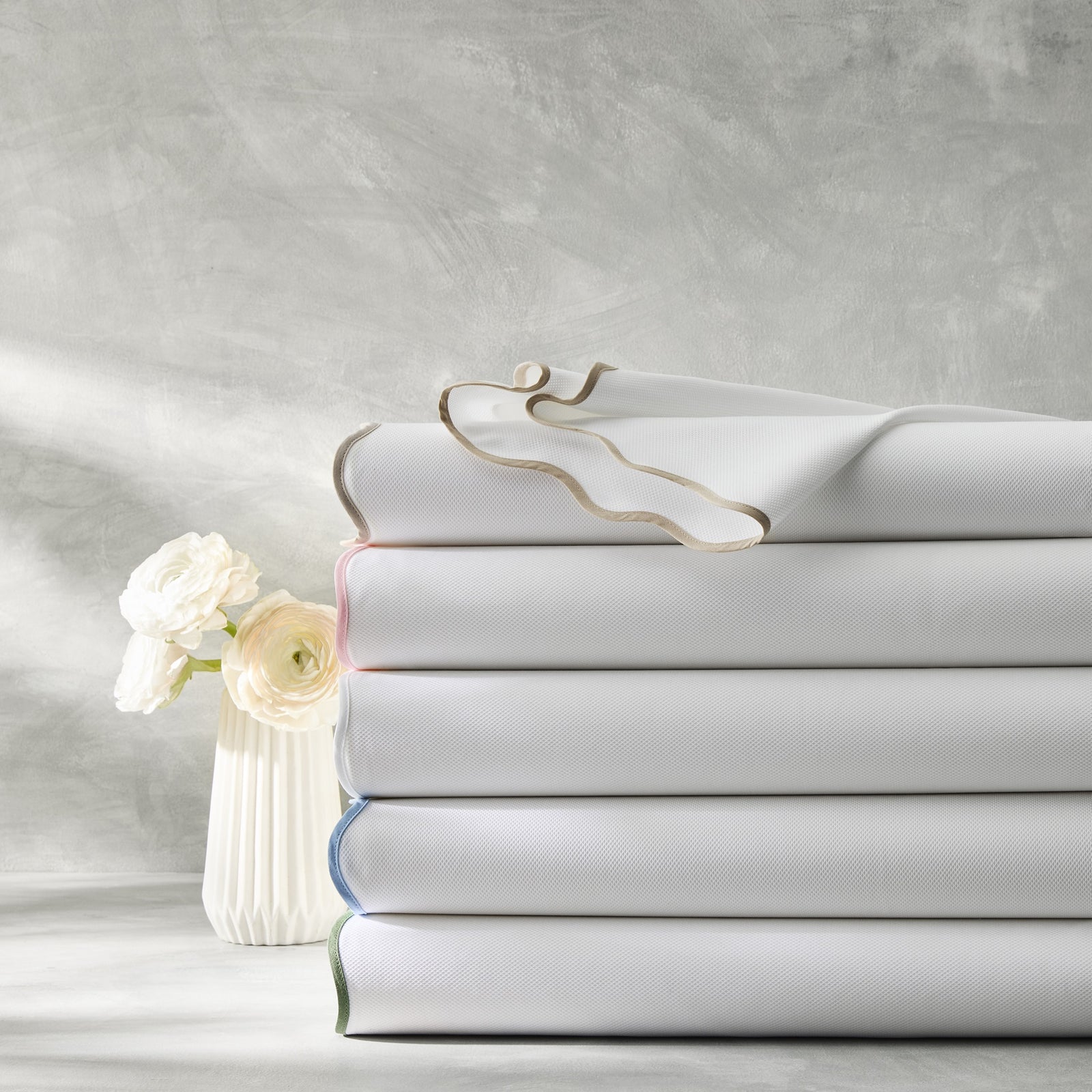 Stack of Matouk Camilla Pique Bedding in All Colors