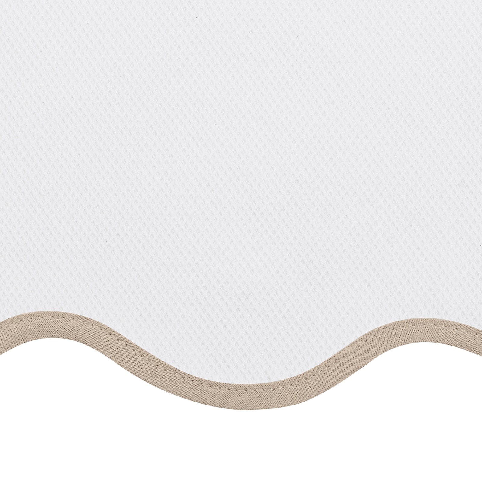 Bed Dressed in Matouk Camilla Pique Bedding with Swatch in Color Dune