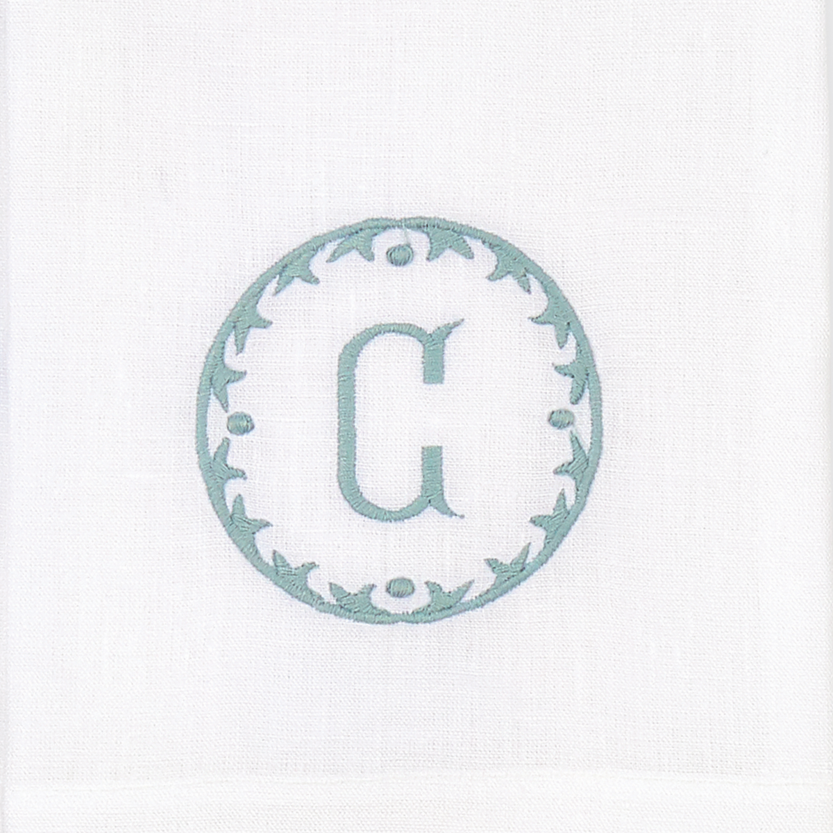 Closeup of Matouk Carta Guest Towels Letter C