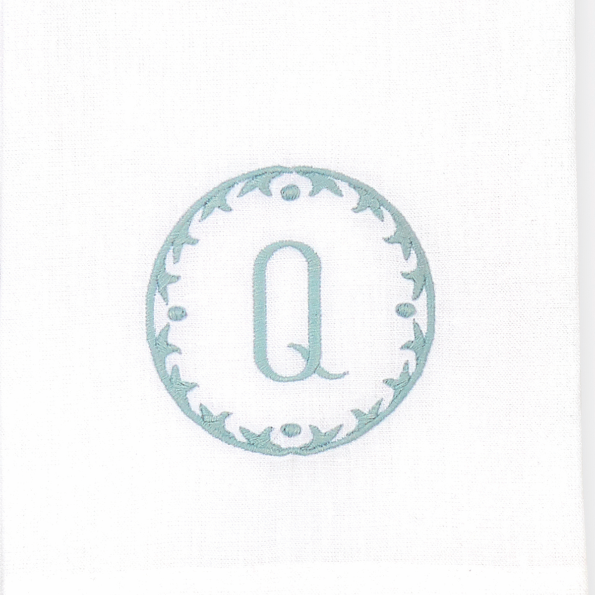 Closeup of Matouk Carta Guest Towels Letter Q
